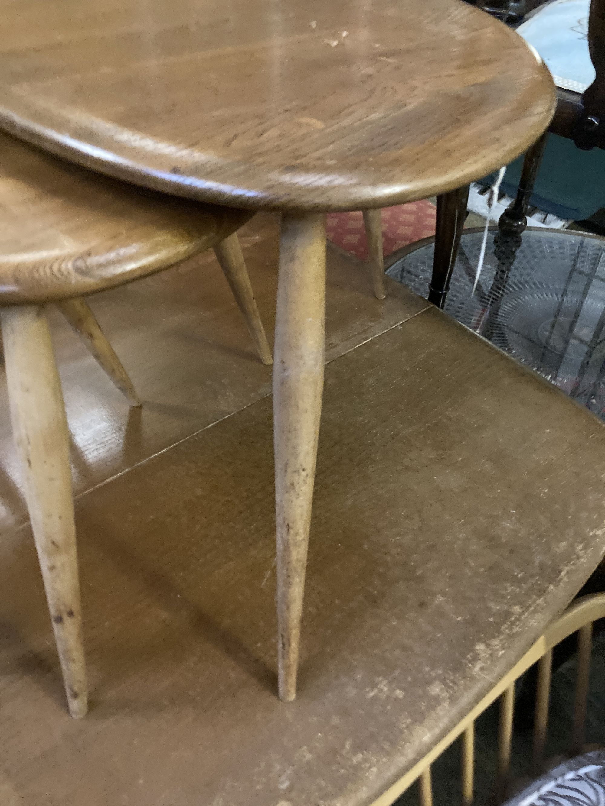 An Ercol nest of three Pebble tables, width 64cm depth 42cm height 40cm